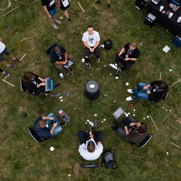 an drone photograph of a lan party, n - 9