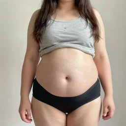 a full - body selfie of sommer ray with an extremely round and distended chubby belly, focus on facial - details!!!!!! facial - details!!!!!!, focus on her belly fat pressing against her clothes, focus on her belly hanging down to her knees, instagram post, 8 k resolution