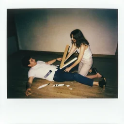 man falling apart while a woman tries to hold the fallen parts, 1 9 1 0 polaroid photo
