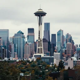 a beautiful, sharp focus, and immaculate overcast futuristic seattle cityscape. vaporwave ombre rendering. outrun style. trending on artstation. recommended for you behance. by chris moore. by edward hopper. beeple colors. ambient occlusion. digital matte painting. metropolis filmic. gotham city.