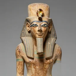 wooden statue of the priest and scribe kaaper, discovered in his mastaba in egypt. the eyes are in rhinestones with copper edges. it is about 4 5 0 0 years old