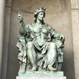 the statue of the liberal is sitting