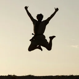 cinematic still of silhouette of man in Biblical clothing jumping for joy, beautiful middle eastern landscape with sunrise behind, Biblical epic movie directed by Steven Spielberg