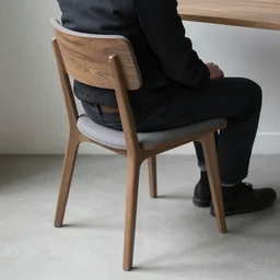 a chair sitting on a person