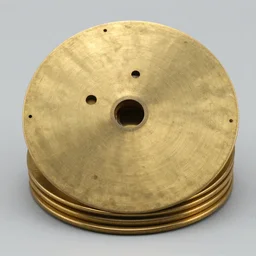 a few brass discs with punch holes stacked, front view, straight composition