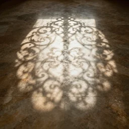 the ornate shape of light is defined by its pattern reflected on the floor