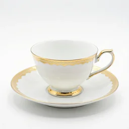 luxurious teacup and saucer, 8k product photo, isolated on a pure white background, centered, entire object in frame, sharp focus, soft studio lighting