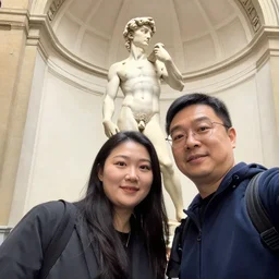 nuns taking a selfie with the statue of david in florence italy