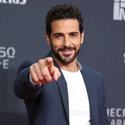 james ferraro pointing at the camera while smiling
