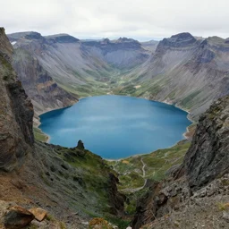 wide angle of a mountains landscape with a blue lake centered, mist, a detailed matte painting by christophe vacher, matte painting, ultra detailed, matte drawing