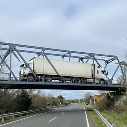 liverpool ny onondaga parkway rail bridge with a semitruck stuck under it