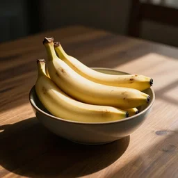 a bowl of banana is on wooden table