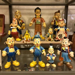 vintage collection of 1 9 6 0 s cartoon occult sculpture toys on display
