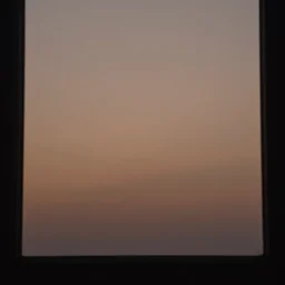 poor quality photo of the sunrise through a window, brown sky
