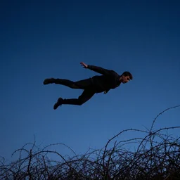 a man flying through thorns to the stars