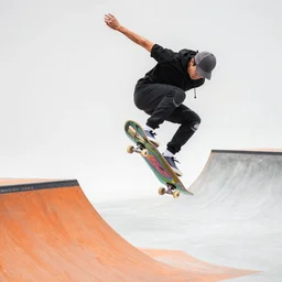 professional photo of a skateboarder performing a grab trick, focused on brightly colored deck, 8 k, bright ambient lighting key light, 8 5 mm f 1. 8