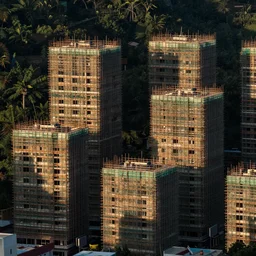 dense buildings scaffolding in Taiwan; half built in the nature