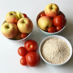 Three bowls on a table are filled with apples, tomatoes and oatmeal.