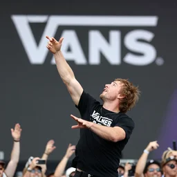 photo still of gallagher at vans warped tour!!!!!!!! at age 6 3 years old 6 3 years of age!!!!!!! throwing bees at a crowd, 8 k, 8 5 mm f 1. 8, studio lighting, rim light, right side key light