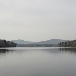 by sarah sze swirling, desaturated. the installation art of two lakes in connecticut, with mountains in the distance.