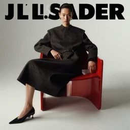 fashion model on red chair, official jil sander editorial