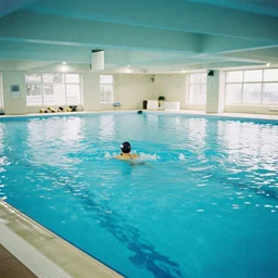 an empty indoor swimming, 35mm color film
