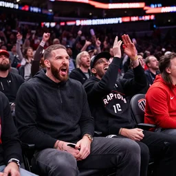 spanish man sitting next to drake cheering on the toronto raptors from the stands at scotiabank arena