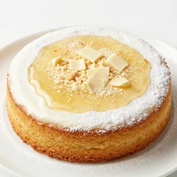 apple syrup over peanut cake with powdered milk and white chocolate crisps