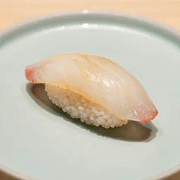 a single nigiri on a plate