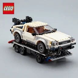 lego 2 0 2 2 delorean time machine being dragged by a tow truck