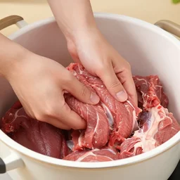 a pot full of raw meat being mixed up barehand, pov, 4 k