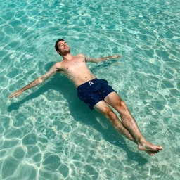 high angle picture of an elegant man relaxing under crystal waters, vivid caustics, extremely beautiful and aesthetic and detailed, with familiar sprites, chiaroscuro, intricate, masterpiece, fantasy illustrations by ilya kuvshinov and jeremy lipking and quentin mabille