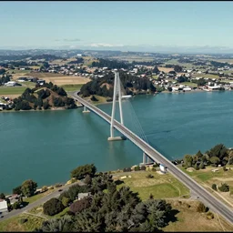 aerial footage of the new 50 km bridge between Wellington, North Island, and Blenheim, South Island, NZ, 8k panorama, grainy IMAX filter