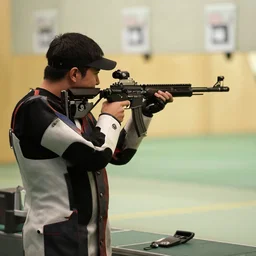 james ferraro shooting a carbine at a shooting range