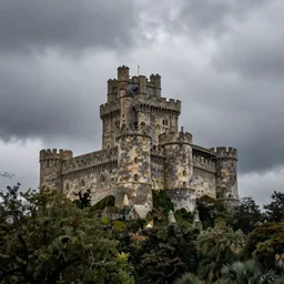 try looming castle under a cloudy sky where nary a ray escapes the god's frown