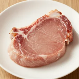 a beautiful dish of a pork chop