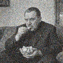 a full shot of nikita khrushchev sitting on a couch and eating a bowl of corn chips in a soviet apartment, high resolution, black and white photo, gaussian blur