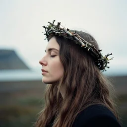 A woman's profile, long hair, closed eyes, wearing a twig crown. masterpiece. hq. detailed. icelandic mood. portra 400 film. cinematic.