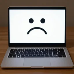 A laptop with a screen showing a sad face