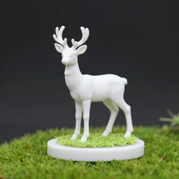 3 d printed figurine of a white - tailed deer on cylindrical base, grassy knoll