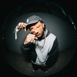 fisheye lens photo of a 9 0 s rapper,