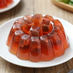 dslr food photograph of a jello mold filled with cubes of beef, 8 5 mm f 1. 8