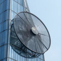 giant fan attached to skyscraper