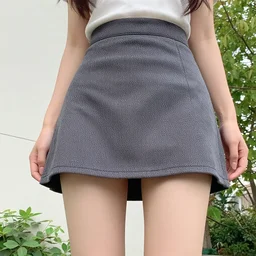 the camera is aimed at a girl dressed in a short skirt, view from below