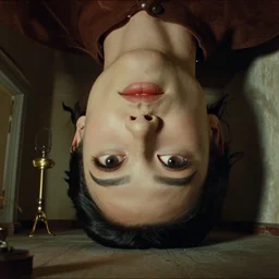 the giant head inside the upside down house, film still from the movie directed by denis villeneuve and david cronenberg, with art direction by salvador dali, wide lens