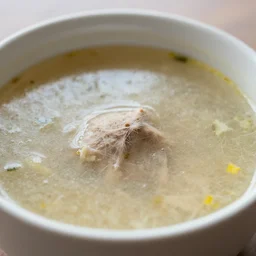 photograph of a bowl of soup with fur, photo - realistic, depth of field