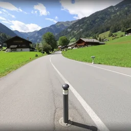 rural austrian street in the alps, no buildings, bollard, google streetview
