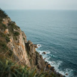 a view of the ocean from a cliff, a tilt shift photo by liam wong, featured on pexels, naturalism, tilt shift, photo, cinematic view