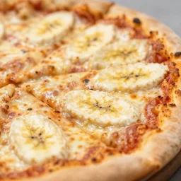 a 5 0 mm macro shot of a banana pizza, depth of field, high resolution