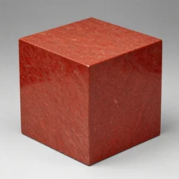 a large cube made of red jasper